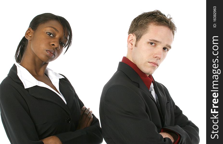 Attractive young business team with serious expressions over white background. Male and female.