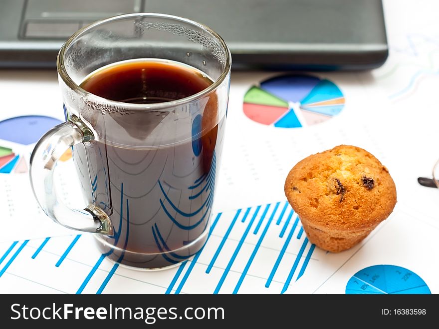 Close-up on stock market data charts, coffee and cake. Close-up on stock market data charts, coffee and cake