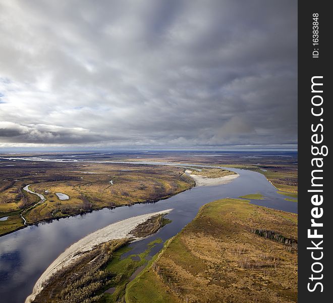 The Aerial view overhand of great river by autumn.