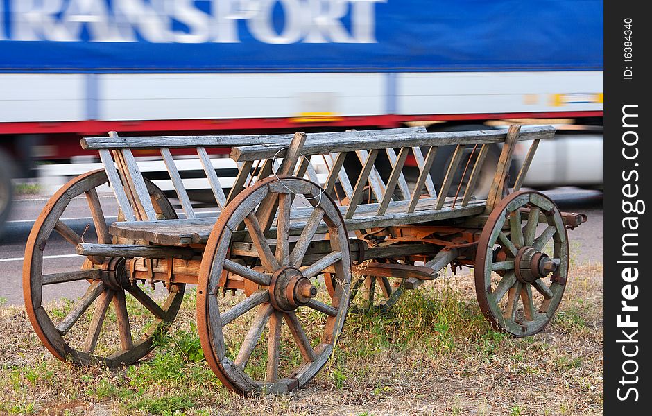 Old horse-drawn cart and newest truck. Old horse-drawn cart and newest truck