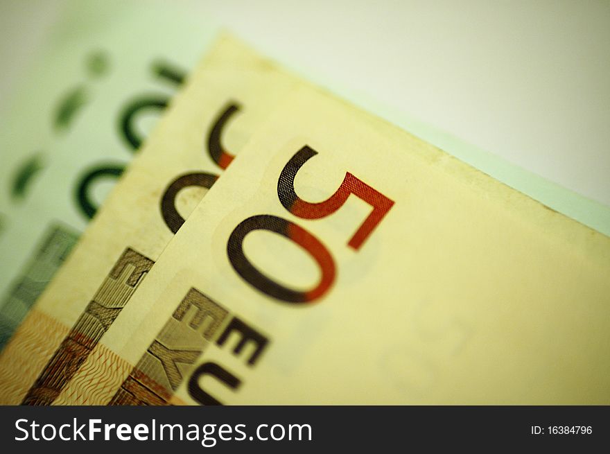 Euro notes close up on white background