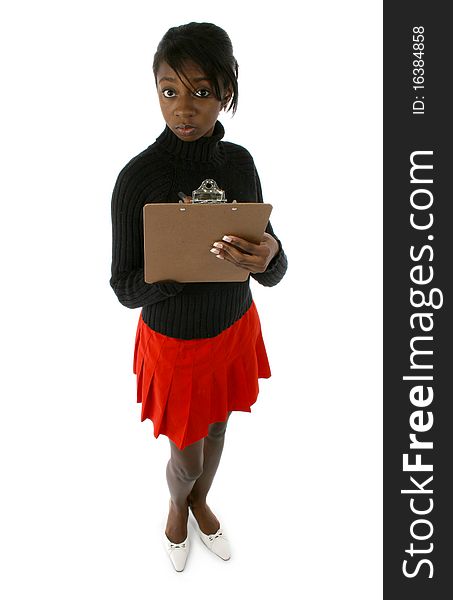 Attractive young african american woman in dress suit with clipboard. Writing on clipboard. Over white background. Attractive young african american woman in dress suit with clipboard. Writing on clipboard. Over white background.