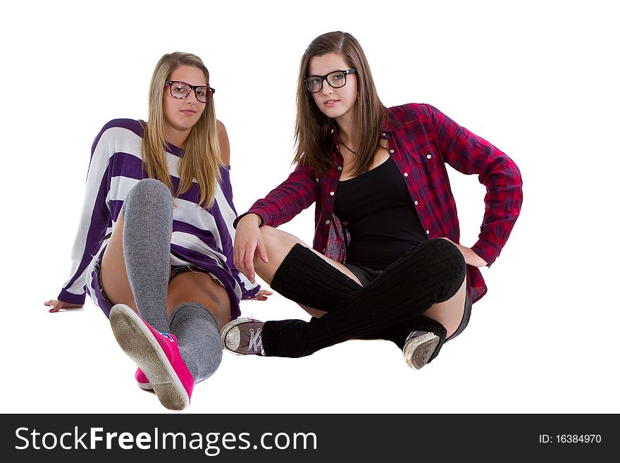 Young trendy teenagers in a nerd / geek style. Isolated over white background. Young trendy teenagers in a nerd / geek style. Isolated over white background.