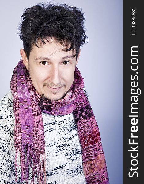 Dishevelled young man with a pink scarf. Dishevelled young man with a pink scarf