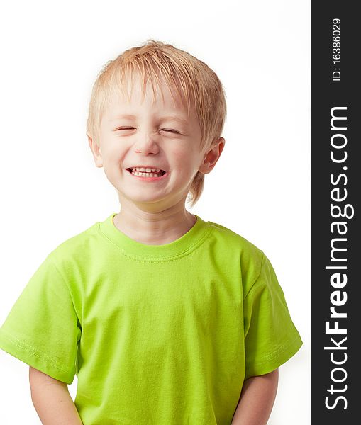 Boy smiling eyes closed, on a light background