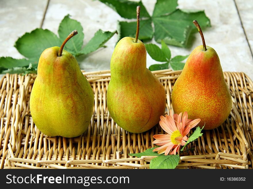 Beautiful ripe pears on a wooden table
