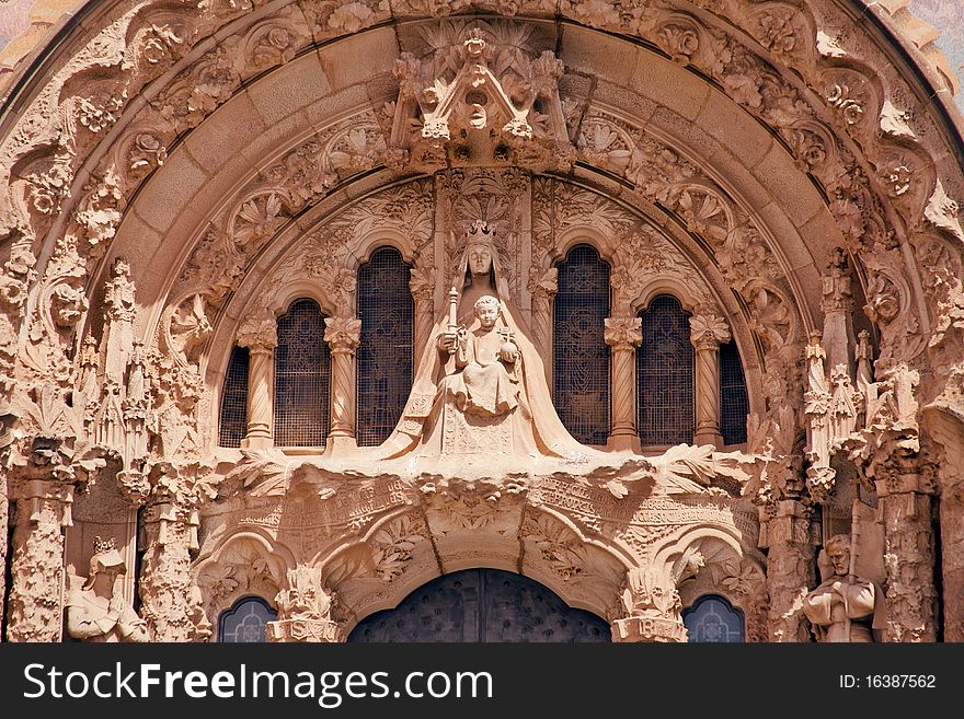 Holy Virgin Madonna on the facade of the cathedral with a small Issus surrounded by saints