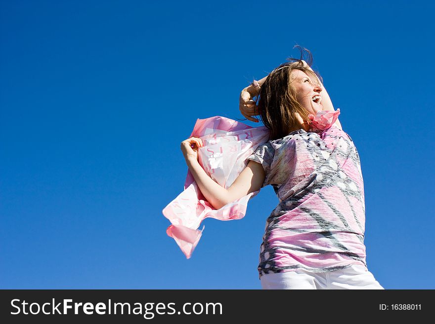 Happy Brunette Playing With A Scarf In The Summer