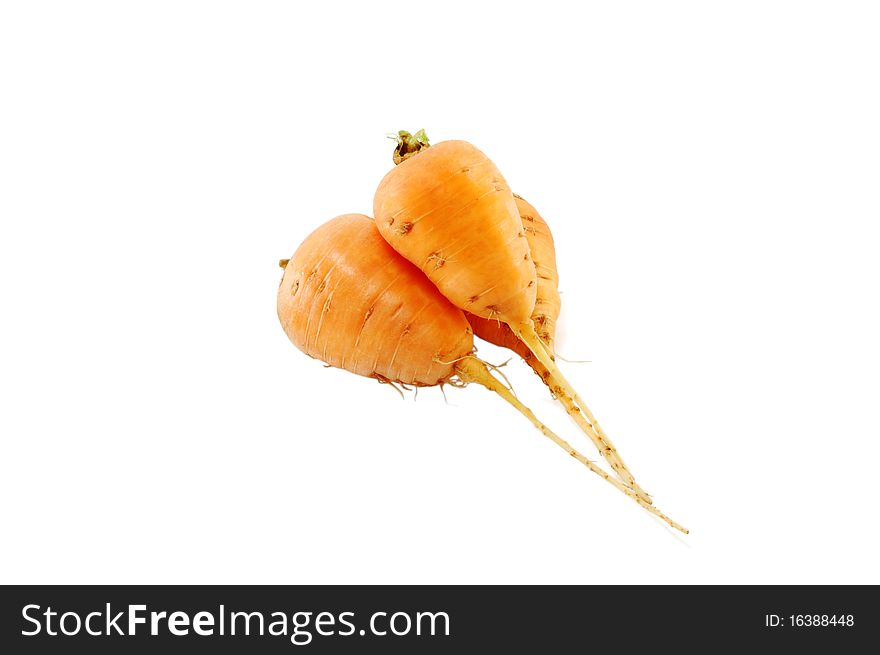 Three carrots are isolated on a white background. Three carrots are isolated on a white background