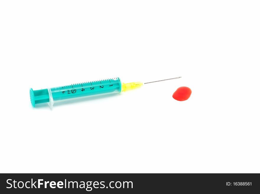 Isolated hypodermic syringe on white with blood