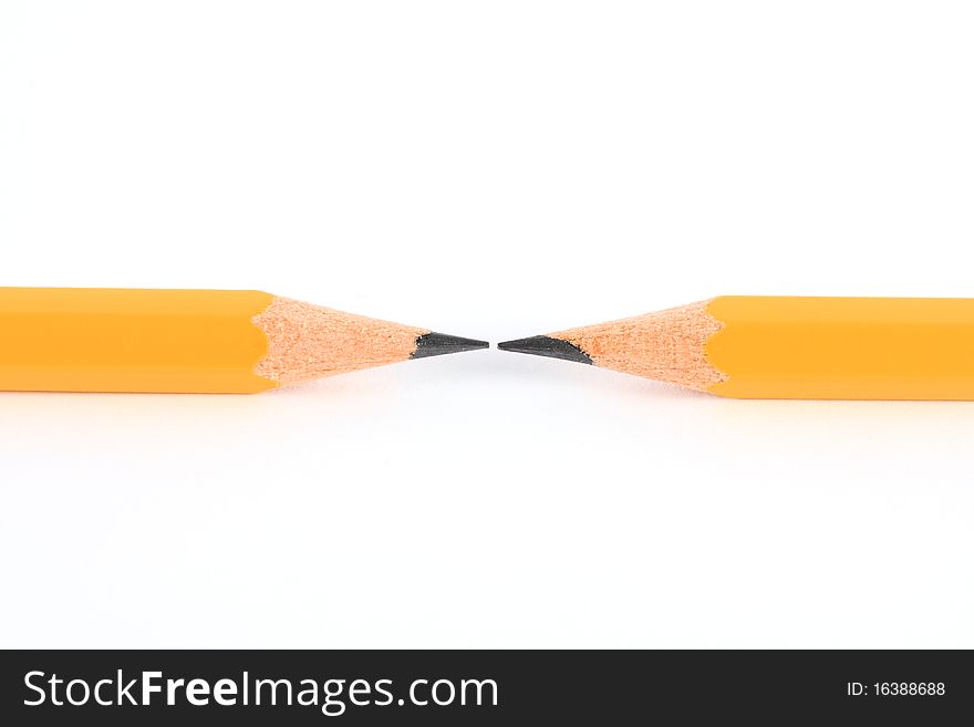 Two pencils in opposite isolated on white.