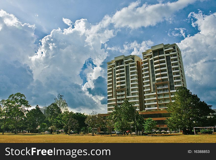 Two high-rise buildings against clouds and the sky. Two high-rise buildings against clouds and the sky.