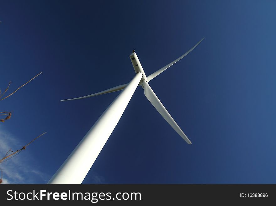 Bottom view of a wind turbine generating electricity. Bottom view of a wind turbine generating electricity.