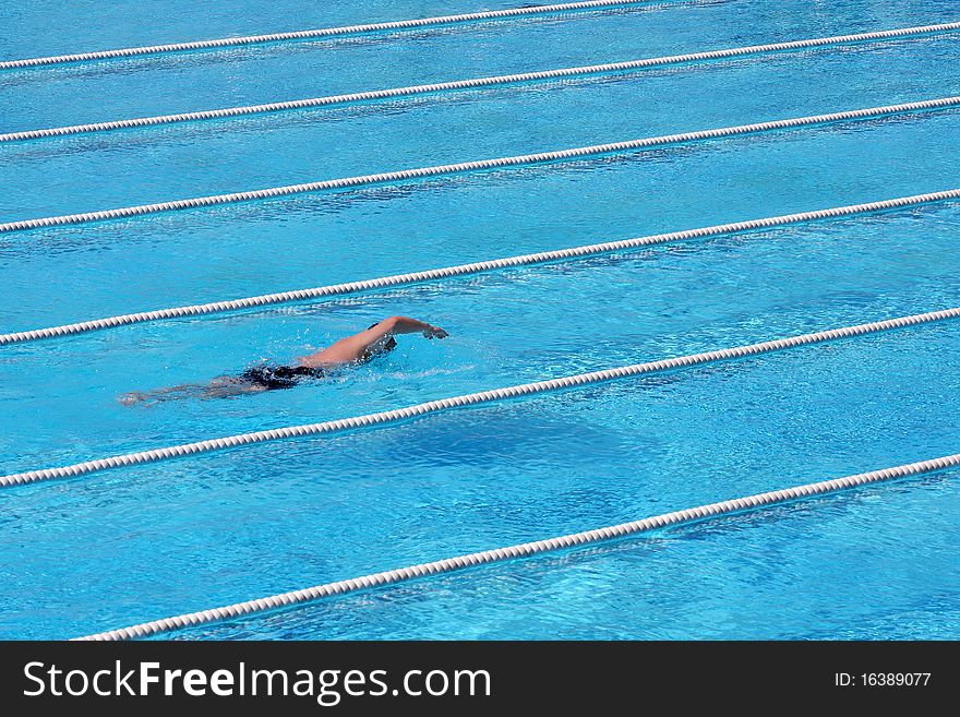Young Male Freestyle Swimmer in Action. Young Male Freestyle Swimmer in Action