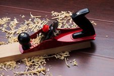 Red Plane On Brick And Shavings. Stock Photos Red Plane On Brick And Shavings. Stock Photos