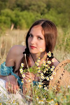 Beautiful Woman In A Field Of Flowers Royalty Free Stock Image