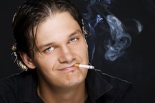 Man Smoking A Cigarette Royalty Free Stock Photos
