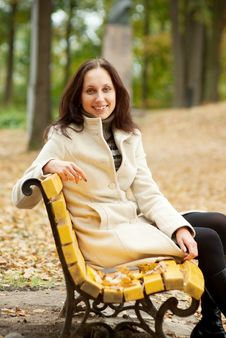 Young Woman Sitting On Bench And Smilling Stock Images Young Woman Sitting On Bench And Smilling Stock Images