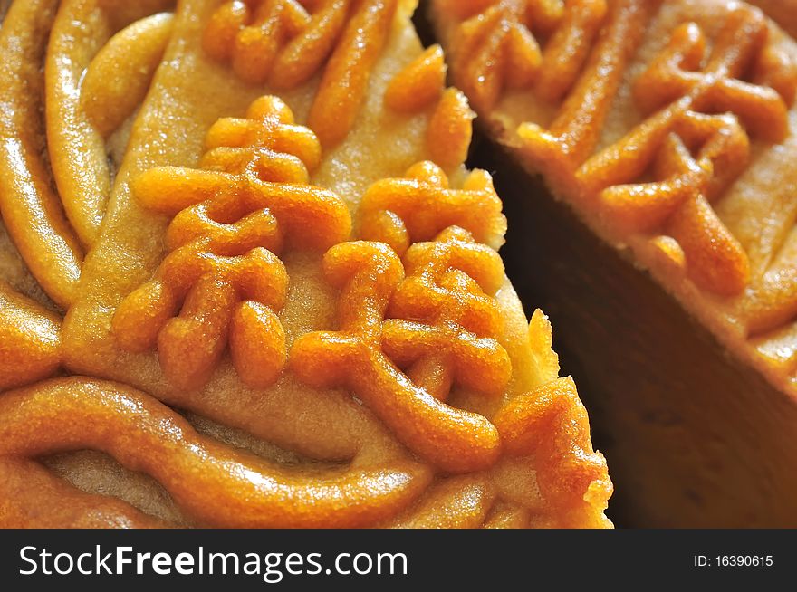 Macro shot of words and texture on a mooncake. Mooncake is consumed in many Asian countries during the mid autumn festival. Macro shot of words and texture on a mooncake. Mooncake is consumed in many Asian countries during the mid autumn festival.