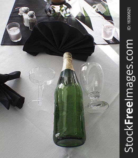 Champagne and glasses set out for guests at a wedding receptions