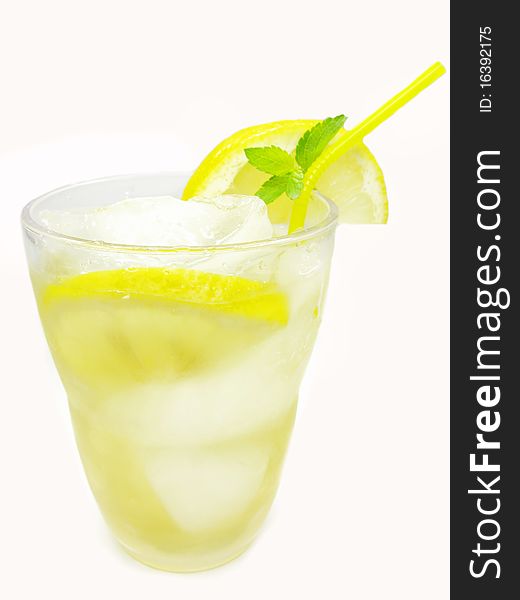 Glasses of fruit yellow lemonade with ice and mint. Glasses of fruit yellow lemonade with ice and mint