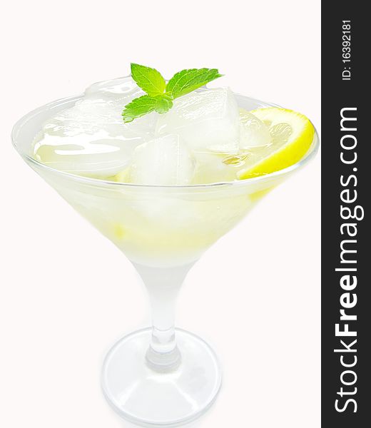 Alcohol yellow liqueur cocktail with ice and lemon. Alcohol yellow liqueur cocktail with ice and lemon