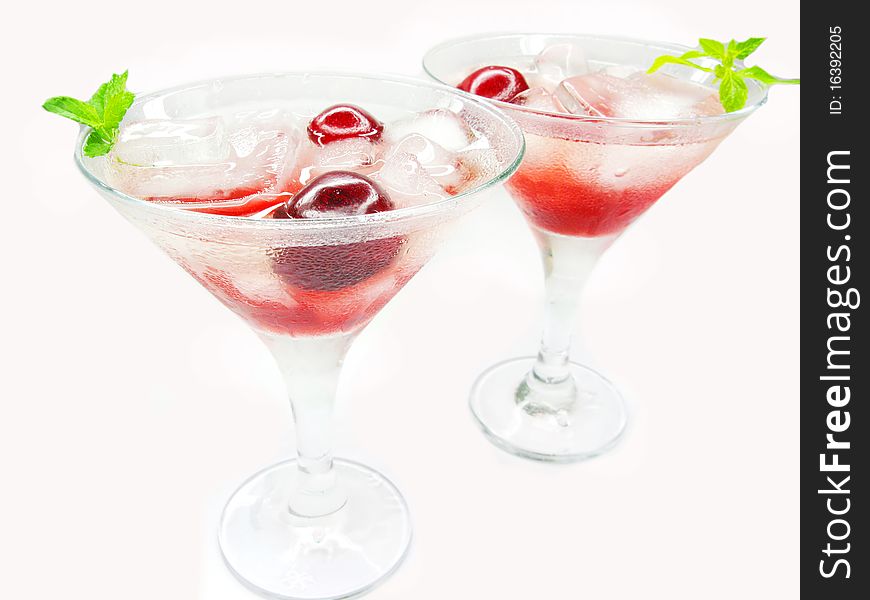 Alcohol red liqueur cocktail with ice and cherry. Alcohol red liqueur cocktail with ice and cherry