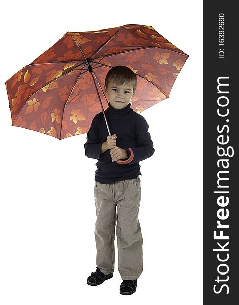 The boy stands and holds an umbrella. The boy stands and holds an umbrella