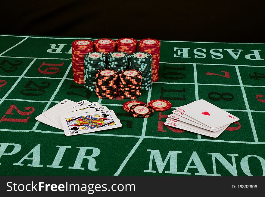 Casino card game showing chips on green cloth background. Casino card game showing chips on green cloth background