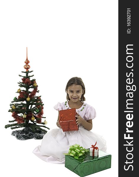 The girl with gifts near to a New Year tree. The girl with gifts near to a New Year tree