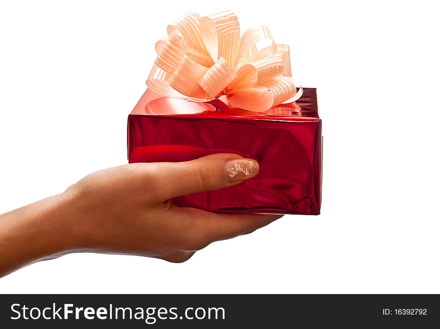 Woman's hand with a small red gift box isolated on white background. Woman's hand with a small red gift box isolated on white background