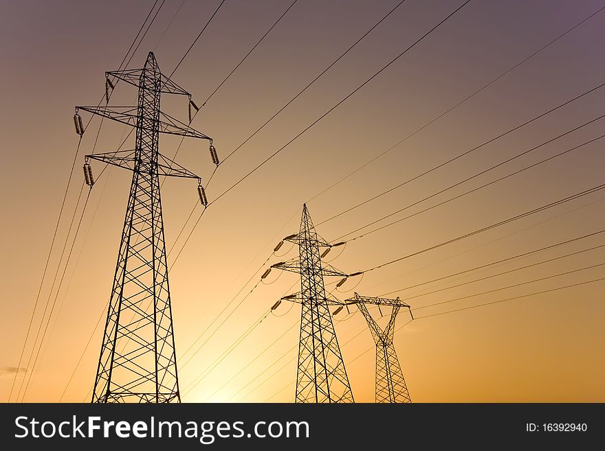 High voltage electricity pylon against sunset. High voltage electricity pylon against sunset