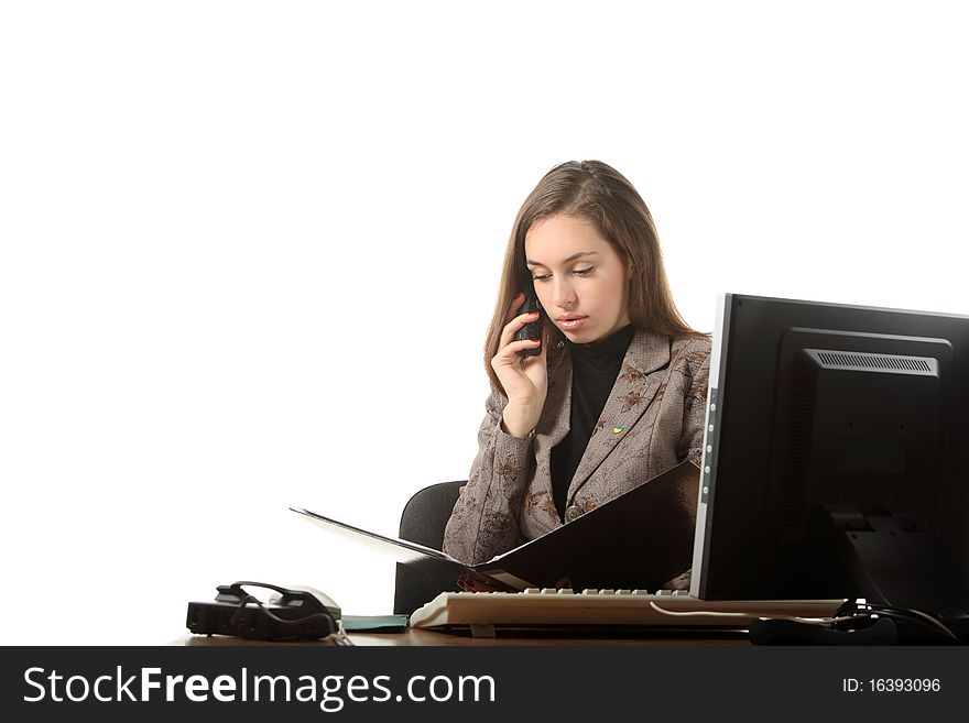 Businesswoman speak by phone and read a document. Businesswoman speak by phone and read a document