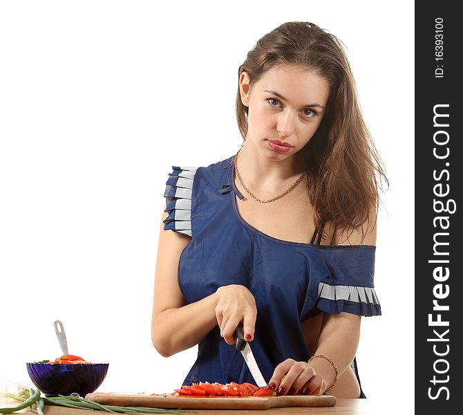 Beautifull girl dressed in apron cook a salad. Beautifull girl dressed in apron cook a salad