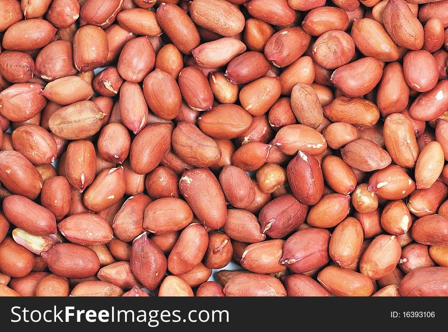 Closeup of red drying peanuts.
