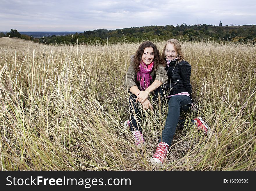 Autumn portrait of two young women