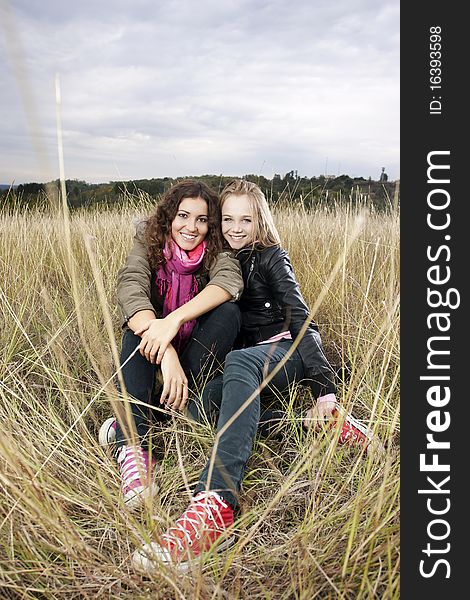 Autumn Portrait Of Two Young Women