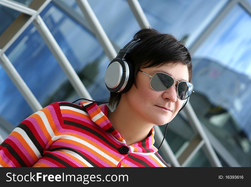 Attractive woman enjoying music outdoors. Attractive woman enjoying music outdoors