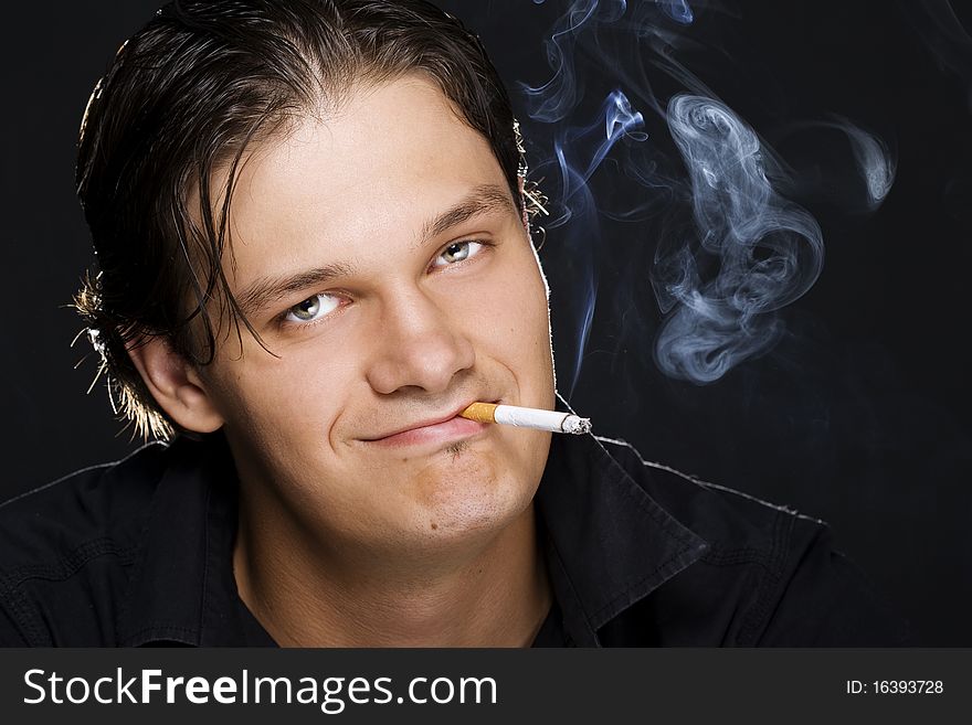 Man Smoking A Cigarette