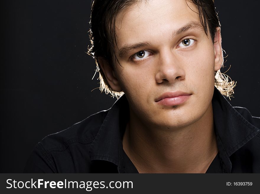 Portrait of young handsome man looking at camera. Portrait of young handsome man looking at camera