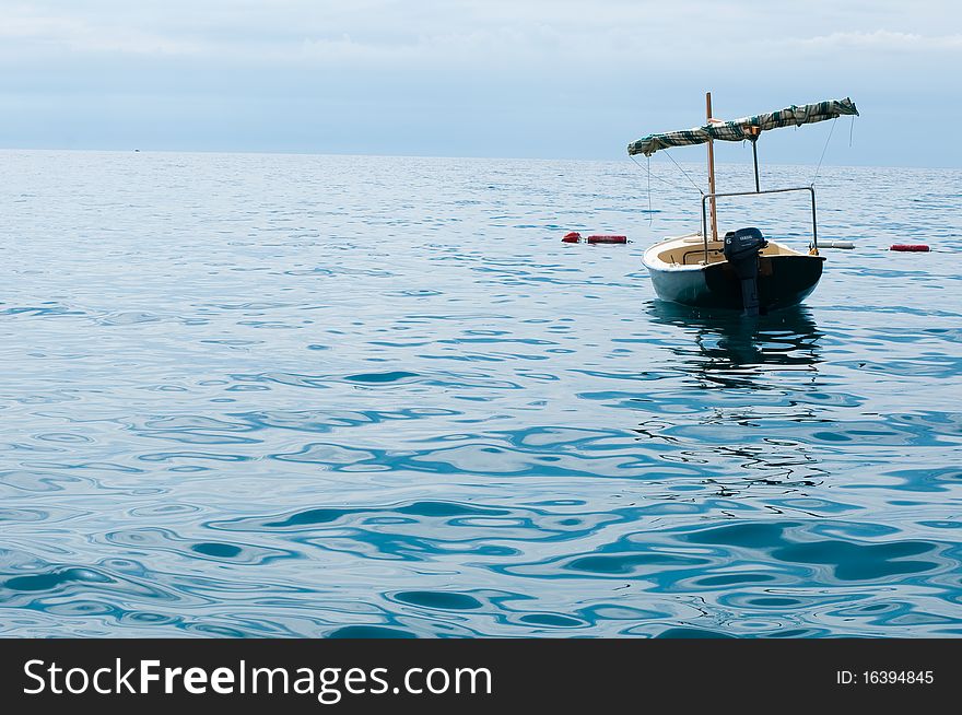 Old forgotten boat in water of Adriatic sea. Old forgotten boat in water of Adriatic sea