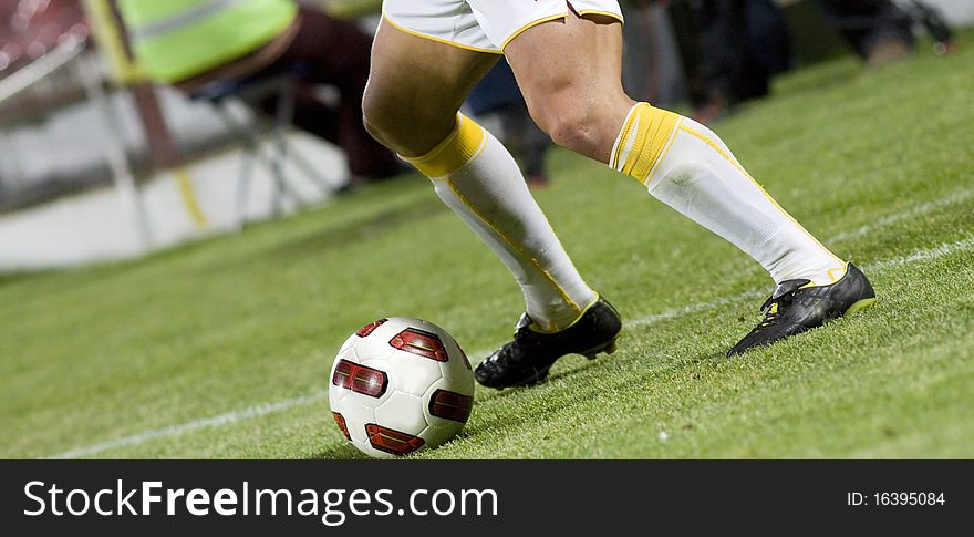 Soccer player running after the ball