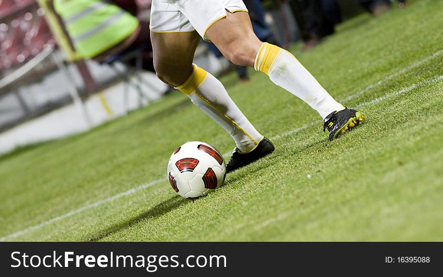 Soccer player running after the ball