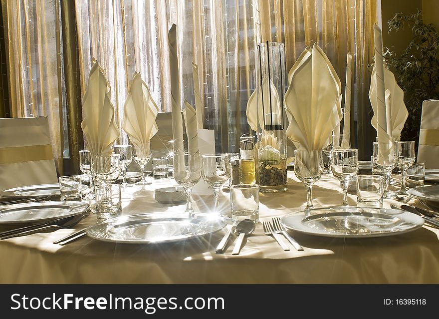 Festive table setting in front of window