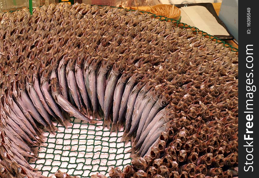 Many fish are decoratively displayed at a Japanese Supermarket. Many fish are decoratively displayed at a Japanese Supermarket.