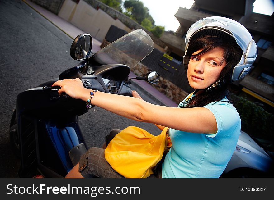 Young caucasian woman is driving a bike. Young caucasian woman is driving a bike