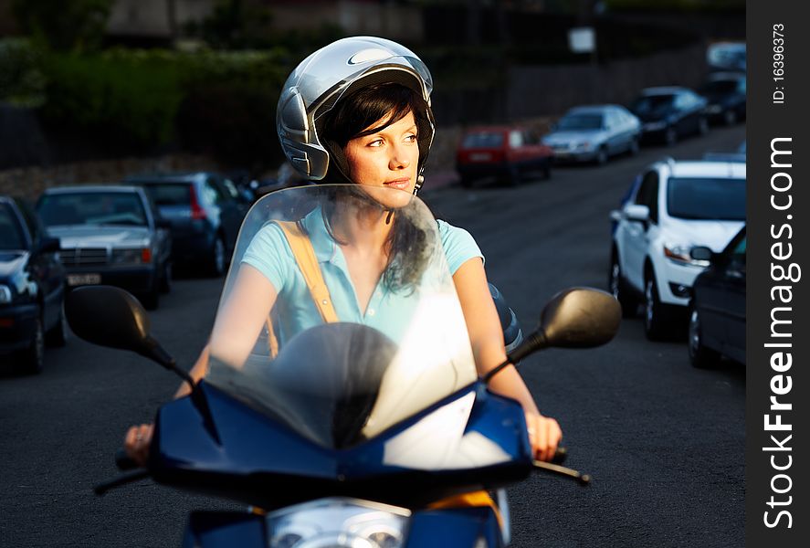 Young caucasian woman is driving a bike. Young caucasian woman is driving a bike