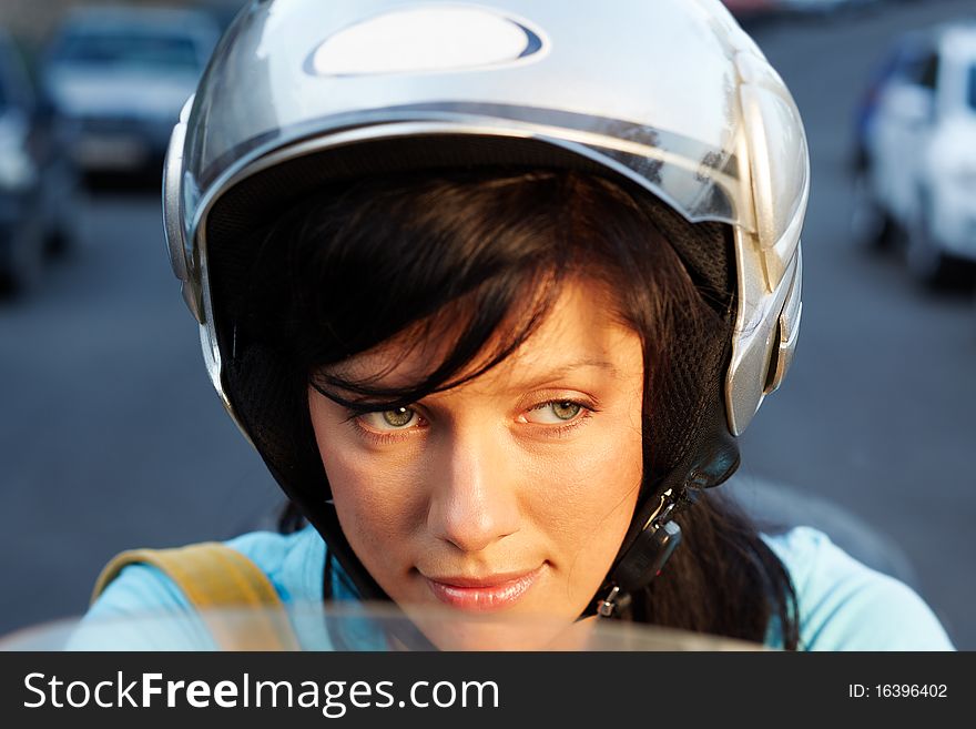 Young caucasian woman is driving a bike. Young caucasian woman is driving a bike