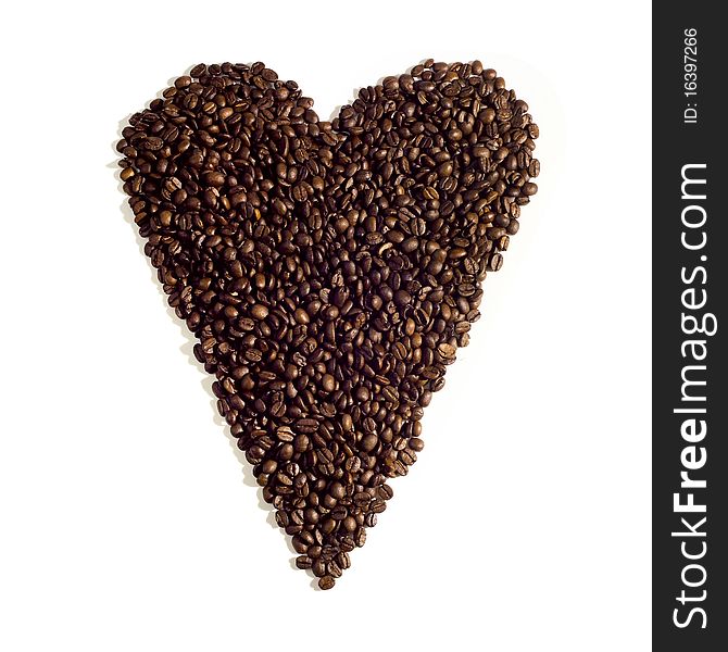 Heart sign made of coffee beans with uncommon lighting. Heart sign made of coffee beans with uncommon lighting