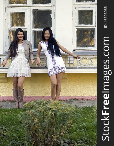 Two female friends walking outdoor